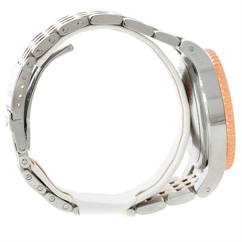 The image shows a side view of the Breitling Navitimer C23340 Men's Steel and Gold (two tone) Silver Dial C23340 Men's Steel and Gold (two tone) Silver Dial watch focusing on the bracelet, case, and bezel.