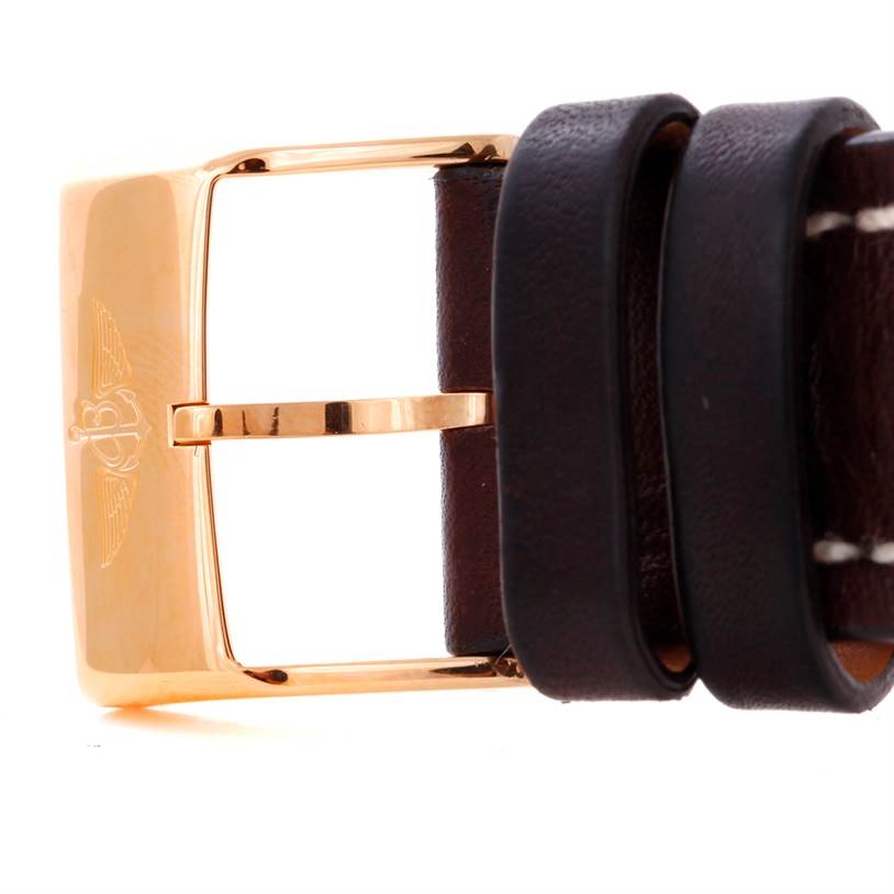 The image shows a close-up of a rose gold buckle and brown leather strap from a Breitling Navitimer H48330 Men's Rose Gold Black Dial H48330 Men's Rose Gold Black Dial watch.