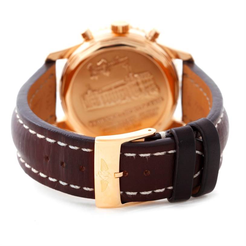 This image shows the back view of the Breitling Navitimer H48330 Men's Rose Gold Black Dial H48330 Men's Rose Gold Black Dial watch, highlighting the case back and leather strap with stitching and buckle.