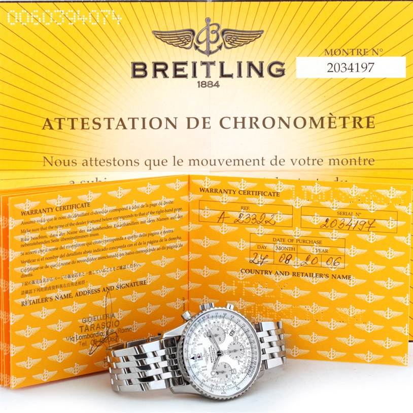 The image shows a Breitling Navitimer A23322 Men's Stainless Steel Silver Dial A23322 Men's Stainless Steel Silver Dial watch and warranty certificate at a slight angle with the face and part of the bracelet visible.