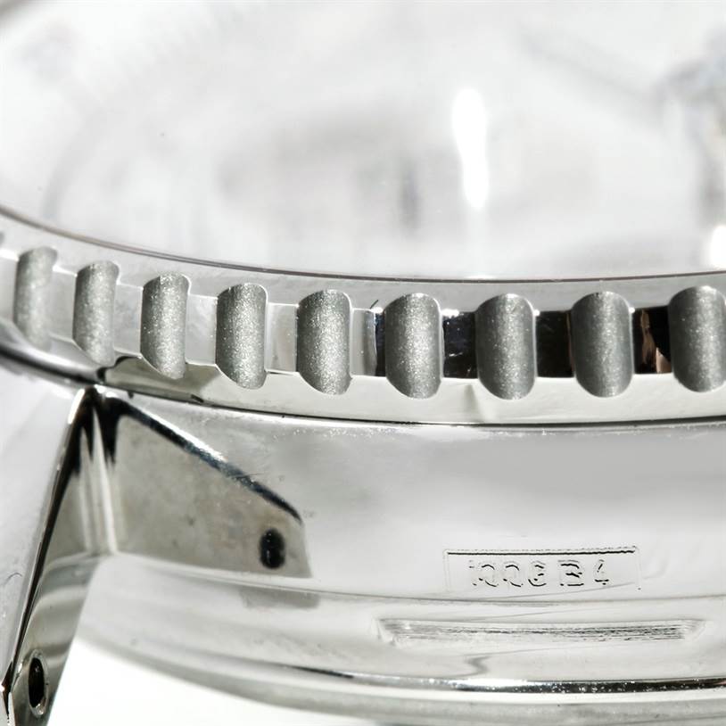 The image shows a close-up of the bezel and part of the case of a Breitling Navitimer A23322 Men's Stainless Steel Silver Dial A23322 Men's Stainless Steel Silver Dial watch.