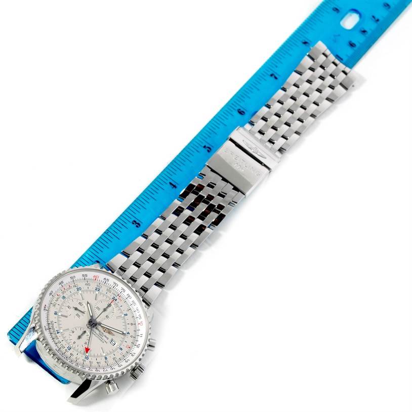 The Breitling Navitimer A24322 Men's Stainless Steel White Dial A24322 Men's Stainless Steel White Dial watch is shown from a top-down angle, displaying its face and metallic bracelet next to a measuring ruler.