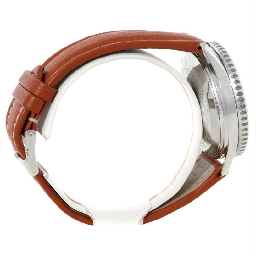 The image shows a Breitling Navitimer A13019 Men's Stainless Steel Black Dial A13019 Men's Stainless Steel Black Dial watch from a side angle, highlighting its brown leather strap and stainless steel case.