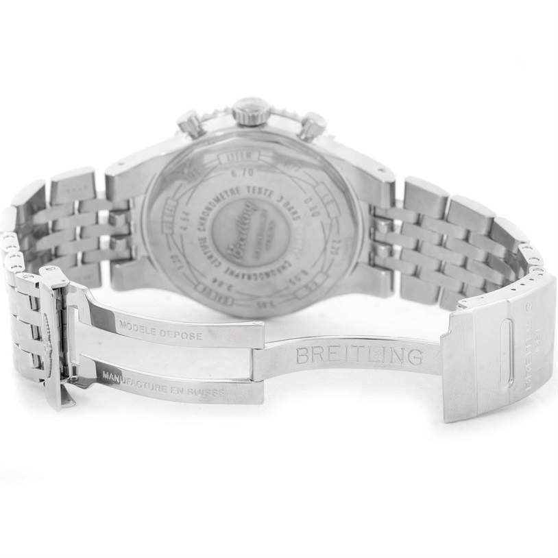 The image shows the back and open clasp of a Breitling Navitimer A23340 Men's Stainless Steel Brown Dial A23340 Men's Stainless Steel Brown Dial watch, displaying its case back engravings and metal bracelet.