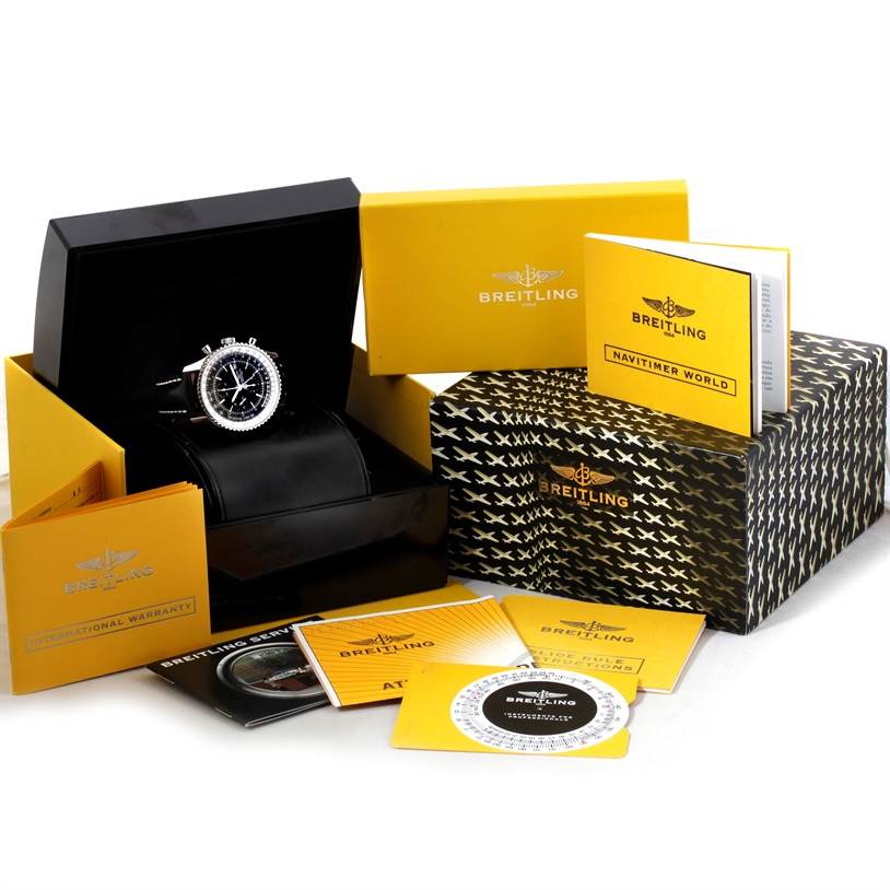 The image shows a Breitling Navitimer A24322 Men's Stainless Steel Black Dial A24322 Men's Stainless Steel Black Dial watch in a presentation box, flanked by various branded manuals and documents.