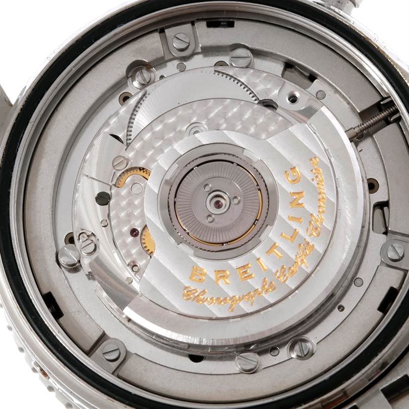 The image shows a close-up of the back of a Breitling Navitimer A19340 Men's Stainless Steel Black Dial A19340 Men's Stainless Steel Black Dial watch, focusing on its intricate automatic movement components.