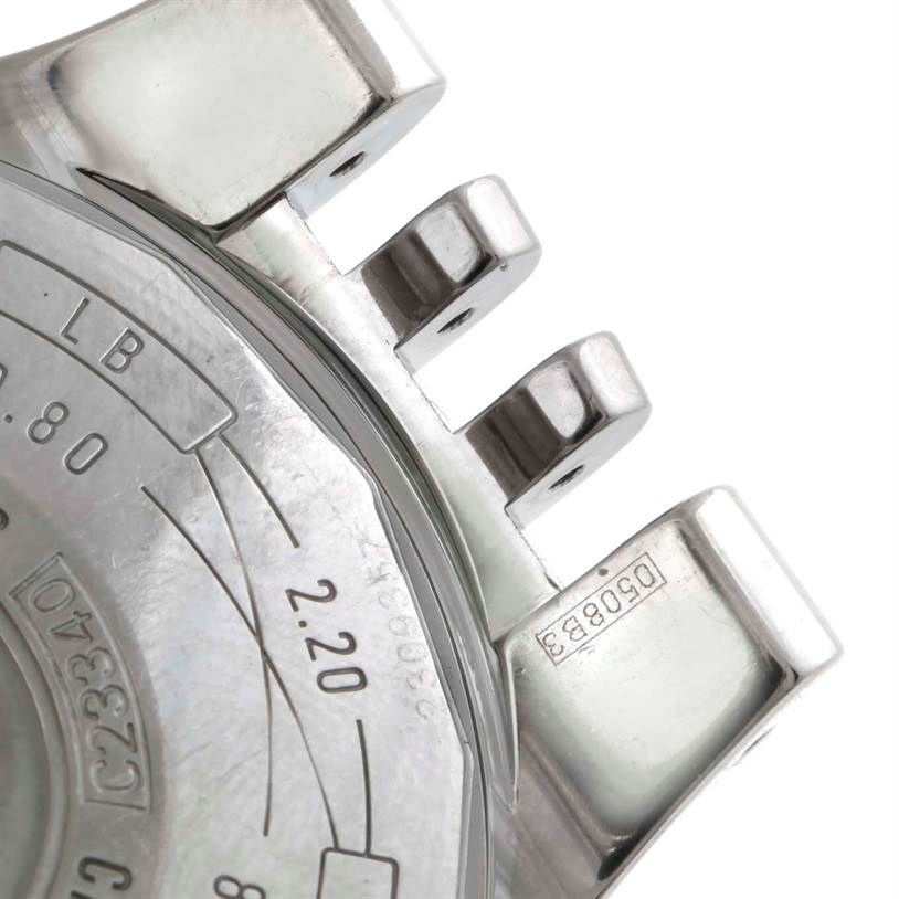 The image shows the side view of a Breitling Navitimer C23340 Men
s Steel and Gold (two tone) Black Dial C23340 Men
s Steel and Gold (two tone) Black Dial watch case and pushers, including the serial number.