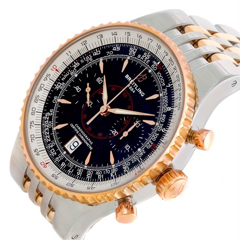 The image shows a side angle of a Breitling Navitimer C23340 Men
s Steel and Gold (two tone) Black Dial C23340 Men
s Steel and Gold (two tone) Black Dial watch, highlighting the dial, bezel, crown, and part of the bracelet.