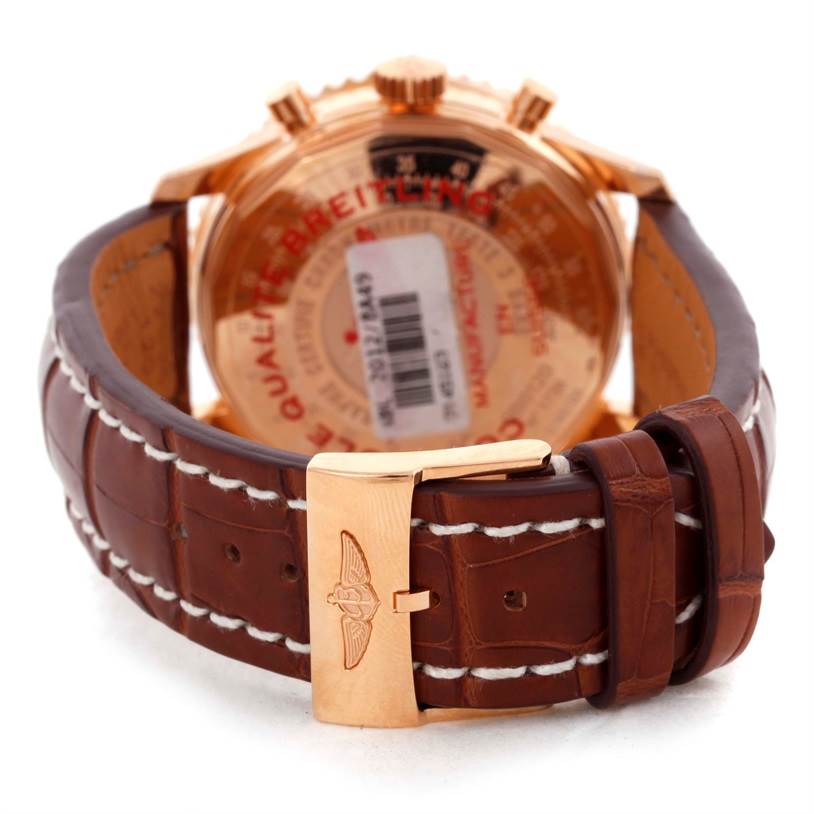 The image shows the rear view of the Breitling Navitimer RB0120 Men's Rose Gold Black Dial RB0120 Men's Rose Gold Black Dial watch, highlighting its leather strap and clasp with the brand logo.