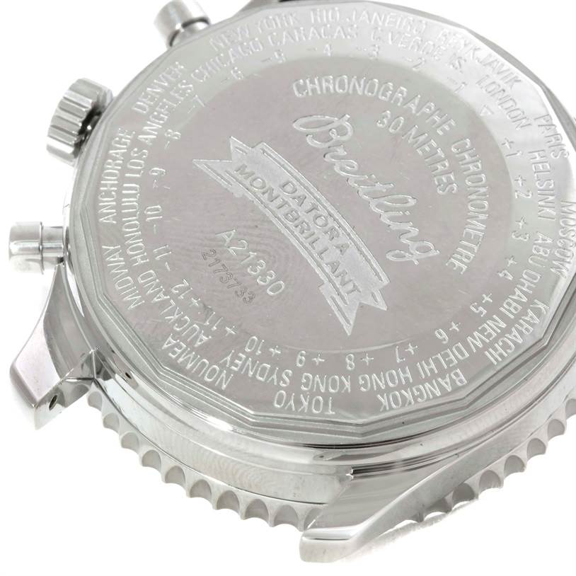 The image shows the back case of a Breitling Navitimer A21330 Men's Stainless Steel Brown Dial A21330 Men's Stainless Steel Brown Dial watch, highlighting its engravings and pushers.