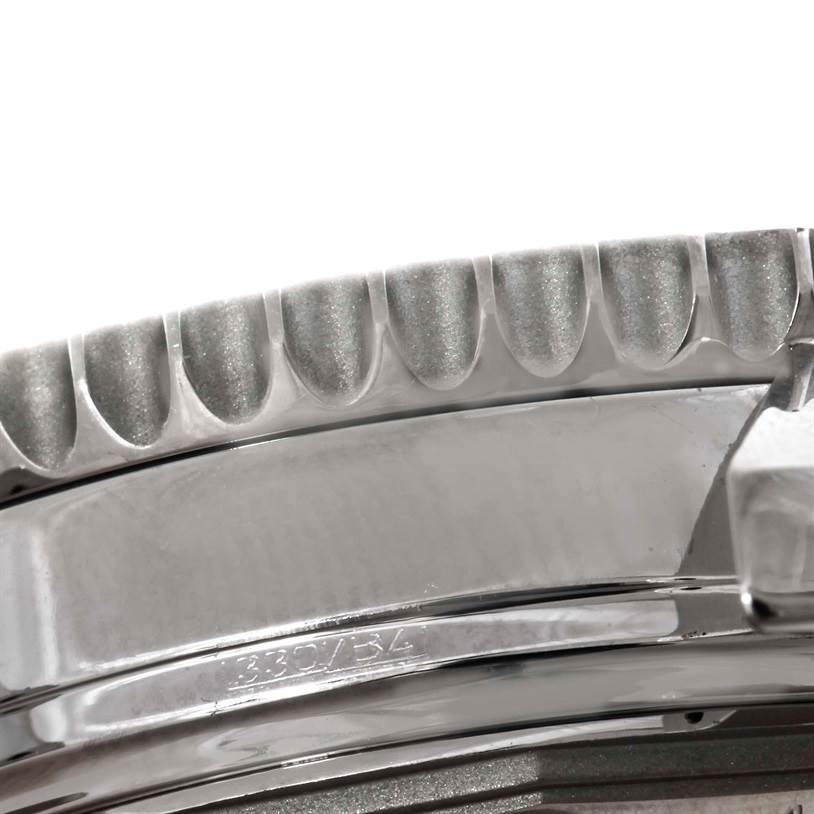 This close-up image shows the fluted bezel and part of the case of a Breitling Navitimer A21330 Men's Stainless Steel Brown Dial A21330 Men's Stainless Steel Brown Dial watch.