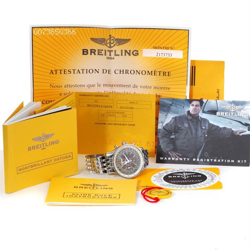 The image shows a Breitling Navitimer A21330 Men's Stainless Steel Brown Dial A21330 Men's Stainless Steel Brown Dial watch alongside its box, certificates, manuals, and other accessories.