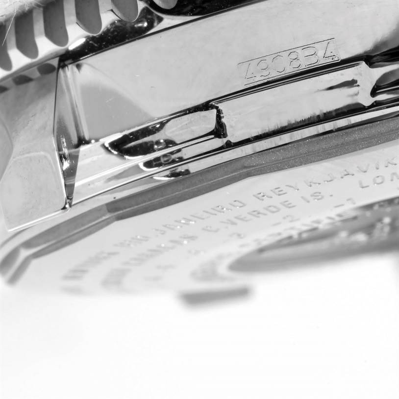 The image shows a macro view of the side and case back of a Breitling Navitimer A24322 Men
s Stainless Steel Silver Dial A24322 Men
s Stainless Steel Silver Dial watch.