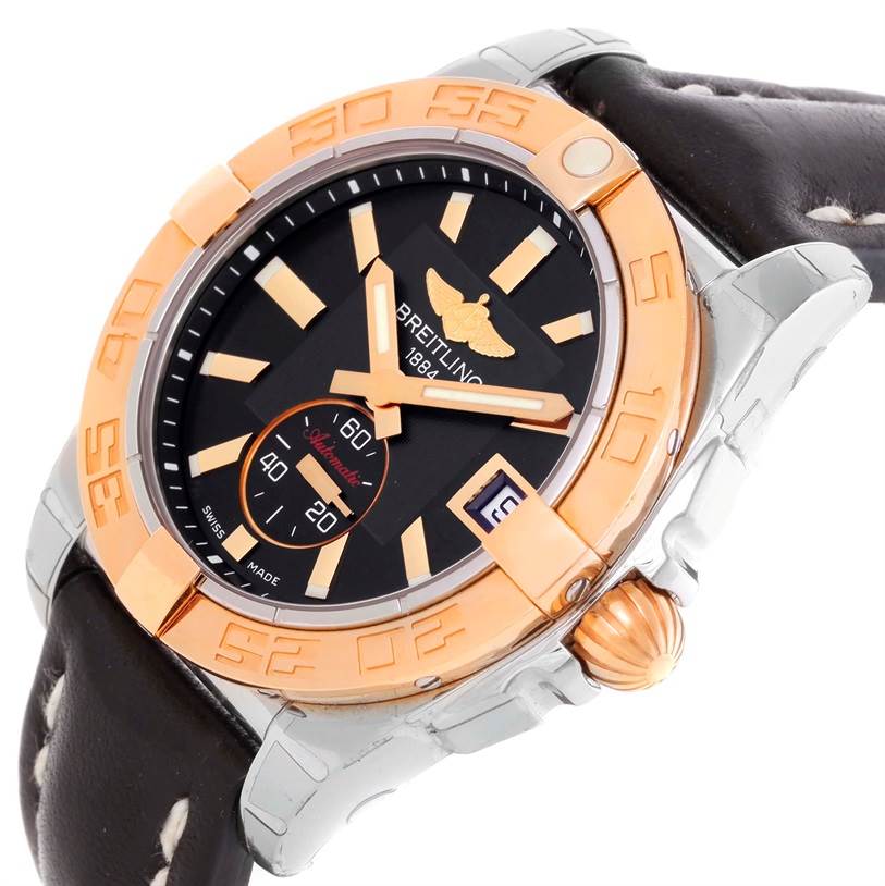 The image shows a close-up, angled view of a Breitling Galactic C37330 Men's Steel and Gold (two tone) Black Dial C37330 Men's Steel and Gold (two tone) Black Dial watch, highlighting its bezel, dial, crown, and part of the leather strap.
