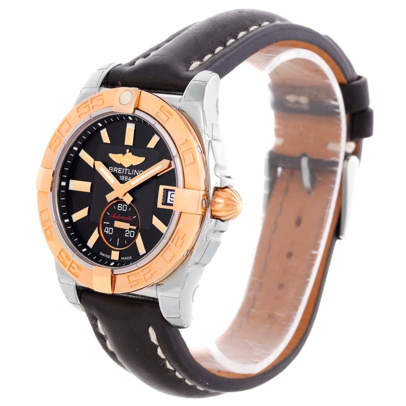 The image shows a Breitling Galactic C37330 Men's Steel and Gold (two tone) Black Dial C37330 Men's Steel and Gold (two tone) Black Dial model watch at a three-quarter angle, displaying its face, bezel, crown, and leather strap.