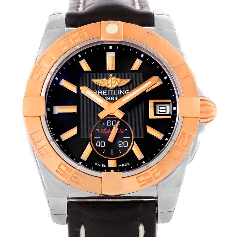 This image shows the front view of the Breitling Galactic C37330 Men's Steel and Gold (two tone) Black Dial C37330 Men's Steel and Gold (two tone) Black Dial watch, displaying its dial, hands, bezel, and part of the strap.