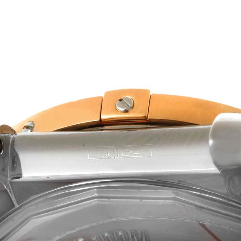 The image shows a close-up of the side of a Breitling Windrider C37330 Steel and Gold (two tone) White Dial C37330 Steel and Gold (two tone) White Dial watch, focusing on the bezel and the casing.