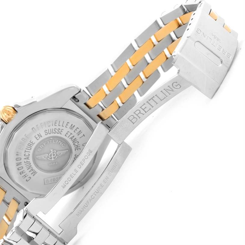 The image shows the back case and partially opened clasp of a Breitling Windrider B49350 Men's Stainless Steel Blue Dial B49350 Men's Stainless Steel Blue Dial watch with a two-tone metal bracelet.