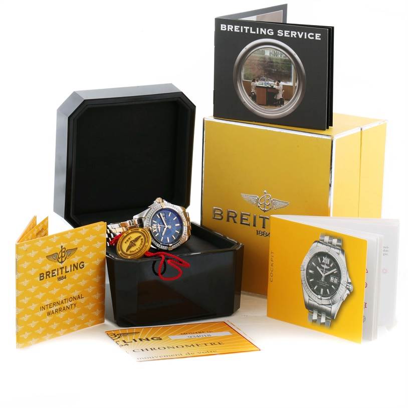 The Breitling Windrider B49350 Men's Stainless Steel Blue Dial B49350 Men's Stainless Steel Blue Dial watch is displayed at an angle, showing its face and accessories, including manuals and warranty cards.