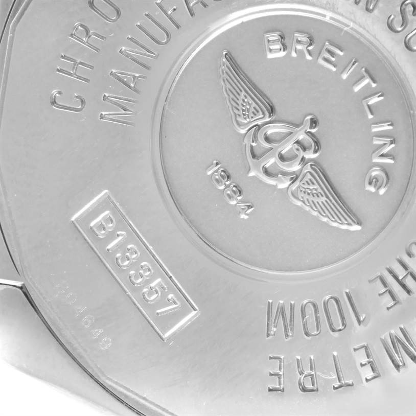 The image shows the back case of a Breitling Windrider B13358 Steel and Gold (two tone) Blue Dial B13358 Steel and Gold (two tone) Blue Dial watch, displaying its logo, serial number, and manufacturing details.