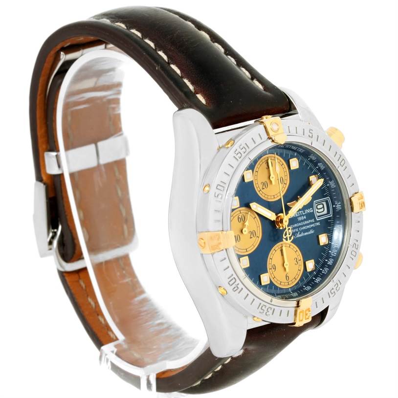 The image shows a Breitling Windrider B13358 Steel and Gold (two tone) Blue Dial B13358 Steel and Gold (two tone) Blue Dial watch from a front-side angle, highlighting the dial, bezel, and leather strap.