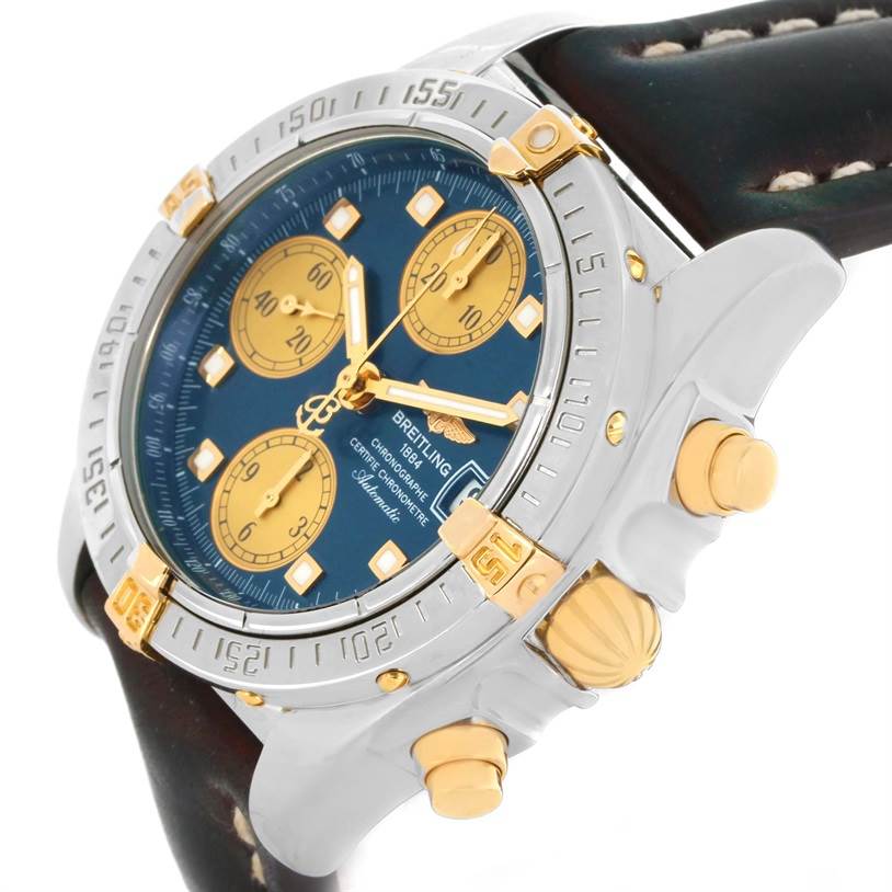 The image shows a close-up angled view of a Breitling Windrider B13358 Steel and Gold (two tone) Blue Dial B13358 Steel and Gold (two tone) Blue Dial watch, featuring the bezel, dial, crown, and pushers.