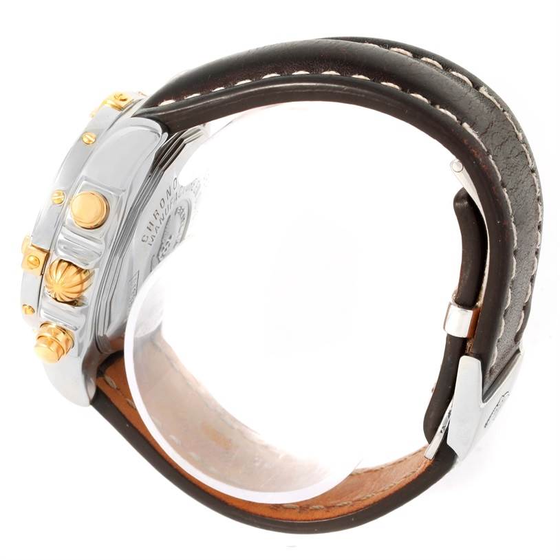 This image shows a side view of a Breitling Windrider B13358 Steel and Gold (two tone) Blue Dial B13358 Steel and Gold (two tone) Blue Dial watch, highlighting the crown, pushers, and leather strap.