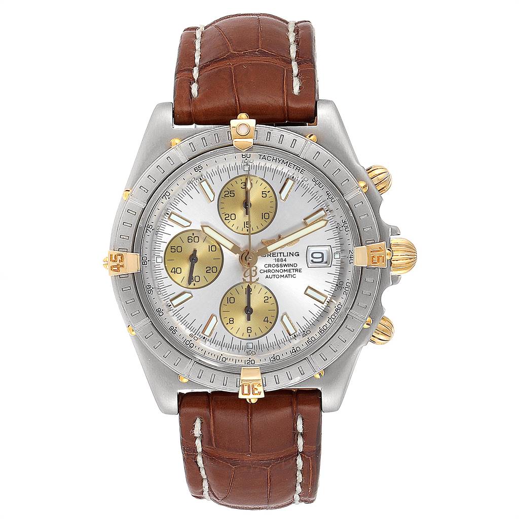 The Breitling Windrider B13355 Men's Steel and Gold (two tone) Silver Dial B13355 Men's Steel and Gold (two tone) Silver Dial watch is shown from a front angle, displaying its dial, bezel, and brown leather strap.
