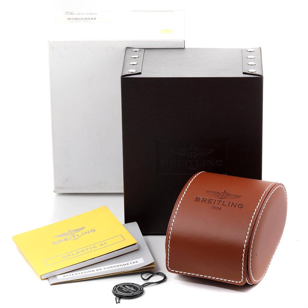 The image shows the packaging and accessories of a Breitling Windrider A49350 Men's Stainless Steel Grey Dial A49350 Men's Stainless Steel Grey Dial watch, including a brown leather case, documentation, and boxes.