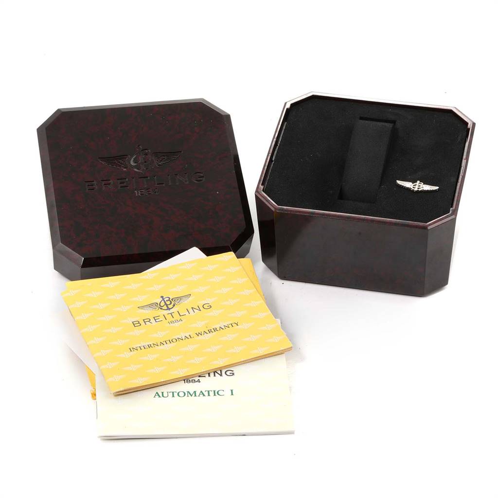 The image shows a Breitling Windrider A10050 Men
s Stainless Steel Black Dial A10050 Men
s Stainless Steel Black Dial watch box, international warranty card, and a manual from a top-down angle.