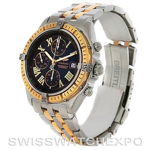 The image shows a side-angle view of the Breitling Windrider D1335512 Men's Steel and Gold (two tone) Grey Dial D1335512 Men's Steel and Gold (two tone) Grey Dial watch, highlighting the bezel, dial, pushers, and part of the bracelet.