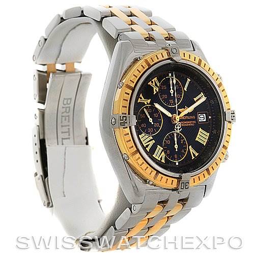 The image shows a Breitling Windrider D1335512 Men's Steel and Gold (two tone) Grey Dial D1335512 Men's Steel and Gold (two tone) Grey Dial watch at an angle displaying the face, bezel, and part of the bracelet and clasp.