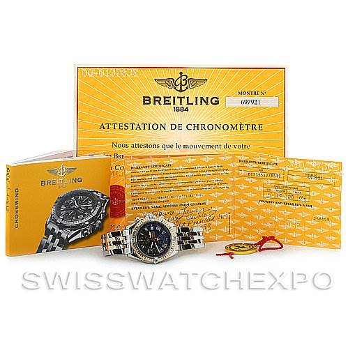 The image shows a Breitling Windrider D1335512 Men's Steel and Gold (two tone) Grey Dial D1335512 Men's Steel and Gold (two tone) Grey Dial watch angled to display the face and bracelet, along with certificates and manuals.