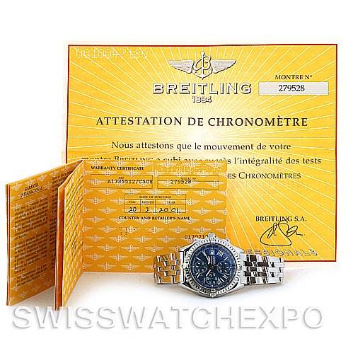 The image shows a Breitling Windrider A1335512 / C508 Men's Stainless Steel Blue Dial A1335512 / C508 Men's Stainless Steel Blue Dial watch, displayed with its certification papers and warranty booklet, taken from a front angle.