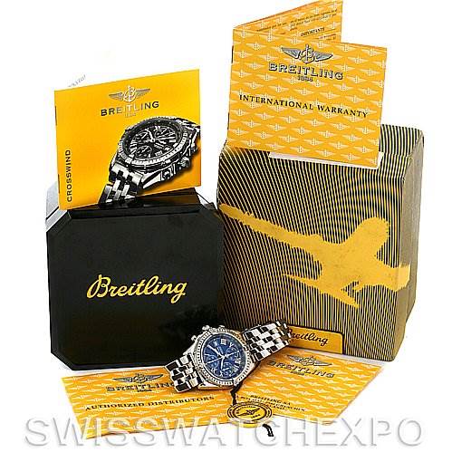 The image shows a Breitling Windrider A1335512 / C508 Men's Stainless Steel Blue Dial A1335512 / C508 Men's Stainless Steel Blue Dial Crosswind watch at an angle, along with its box, warranty, and instructional materials.