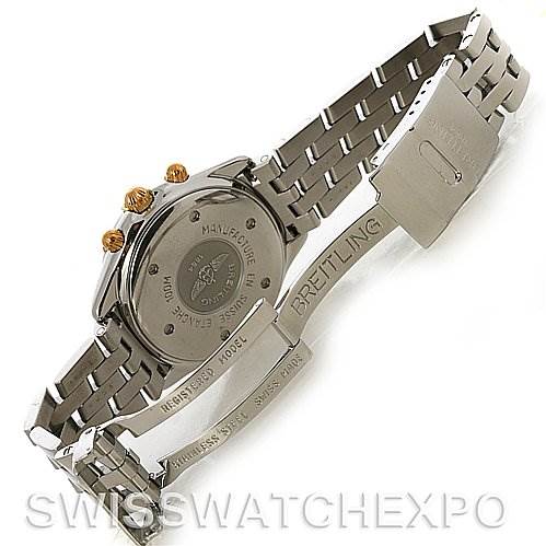 The image shows the back case and bracelet of a Breitling Windrider B55048 Men's Steel and Gold (two tone) White Dial B55048 Men's Steel and Gold (two tone) White Dial watch, highlighting the engraved clasp and links.