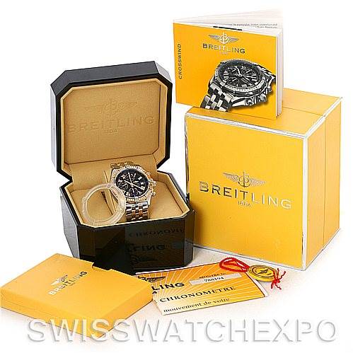 The image shows a Breitling Windrider D1335512 Men's Steel and Gold (two tone) Black Dial D1335512 Men's Steel and Gold (two tone) Black Dial watch in its open box, alongside its yellow outer box, manuals, and warranty card.