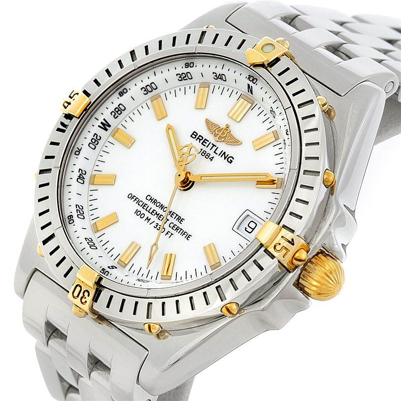The image shows a close-up, angled view of the Breitling Windrider B10350 Men's Steel and Gold (two tone) White Dial B10350 Men's Steel and Gold (two tone) White Dial watch, featuring its face, bezel, and part of the bracelet.