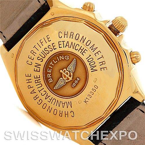 The image shows the gold case back of the Breitling Windrider K13350 Men's Steel and Gold (two tone) Black Dial K13350 Men's Steel and Gold (two tone) Black Dial watch, featuring engraving and branding details.