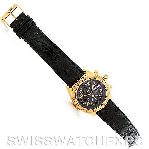 The image shows a full view of the Breitling Windrider K13350 Men's Steel and Gold (two tone) Black Dial K13350 Men's Steel and Gold (two tone) Black Dial watch, featuring a black leather strap and a gold case with a black dial.