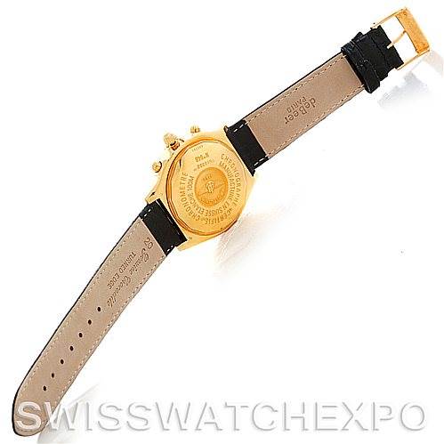 The image shows the back view of a Breitling Windrider K13352 Men's Yellow Gold Black Dial K13352 Men's Yellow Gold Black Dial watch, highlighting the case back and leather strap with a buckle.