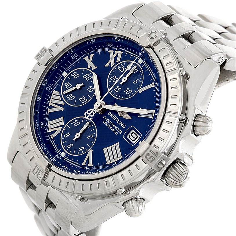 The Breitling Windrider A13355 Men's Stainless Steel Blue Dial A13355 Men's Stainless Steel Blue Dial watch is shown from an angled side view, highlighting the blue dial, chronograph sub-dials, date window, and stainless steel bracelet.