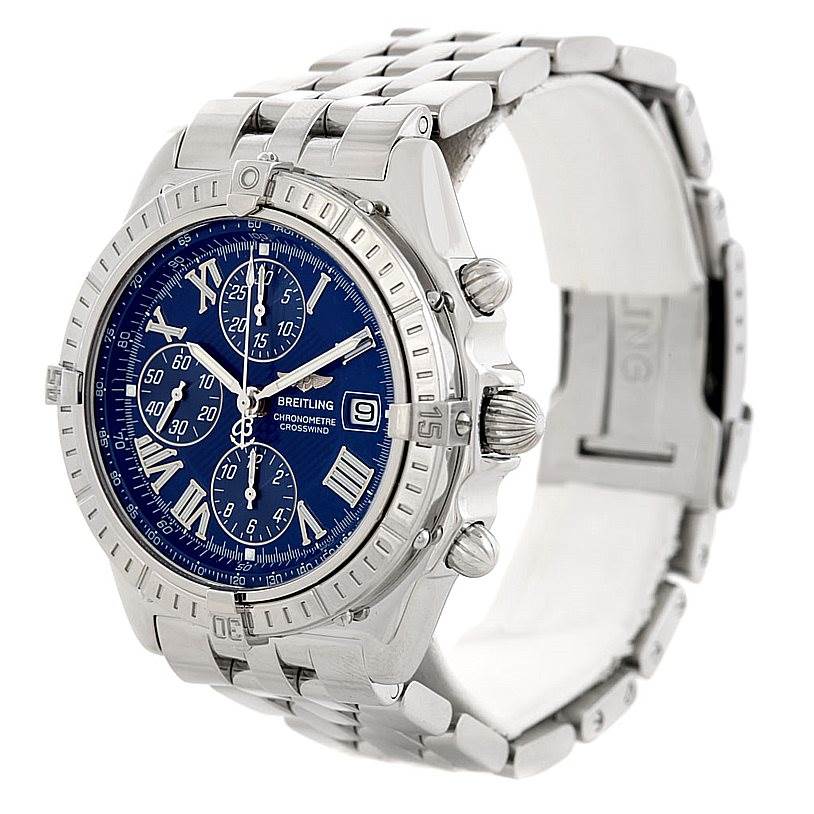 This Breitling Windrider A13355 Men's Stainless Steel Blue Dial A13355 Men's Stainless Steel Blue Dial watch is shown from an angle highlighting the face, bezel, chronograph buttons, and metal bracelet.