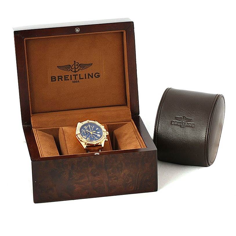 The Breitling Windrider K13055 Men
s Yellow Gold Blue Dial K13055 Men
s Yellow Gold Blue Dial watch is shown in its open display box, with a closed case next to it.