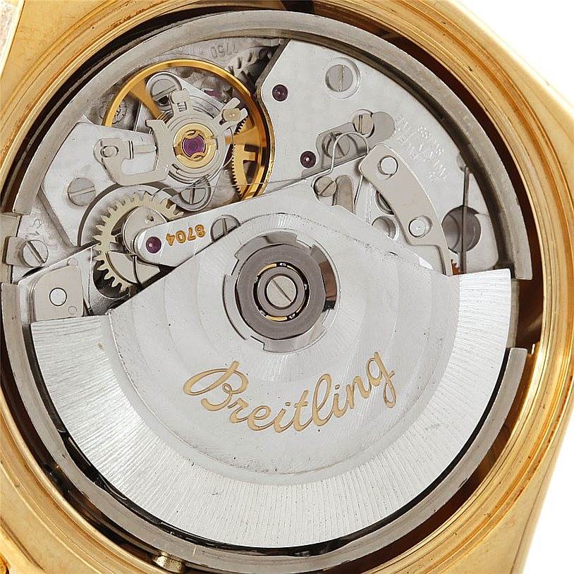 This image shows the internal mechanical movement of the Breitling Windrider K13055 Men
s Yellow Gold Blue Dial K13055 Men
s Yellow Gold Blue Dial watch from a close-up, rear angle.