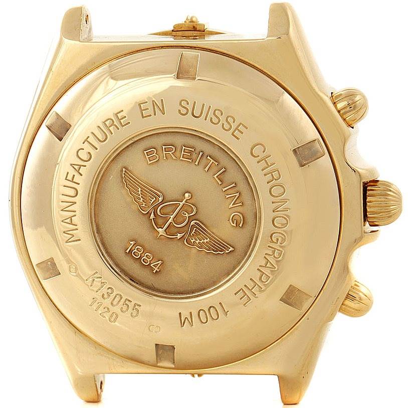 This image shows the back casing of a Breitling Windrider K13055 Men
s Yellow Gold Blue Dial K13055 Men
s Yellow Gold Blue Dial watch, highlighting its brand engravings and chronograph controls.
