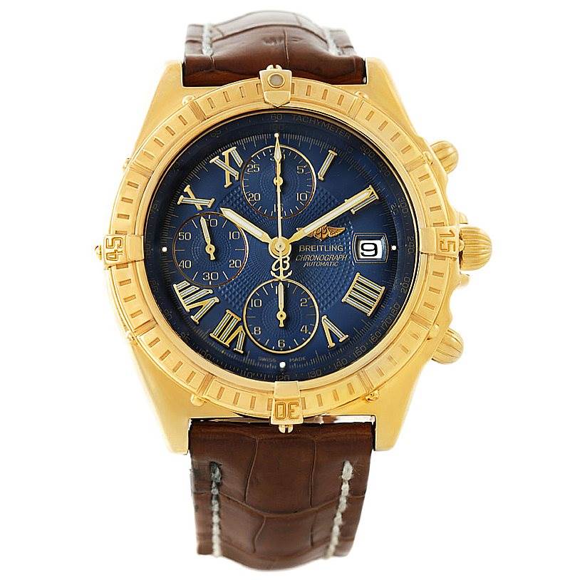 This is a front view of a Breitling Windrider K13055 Men
s Yellow Gold Blue Dial K13055 Men
s Yellow Gold Blue Dial watch showing the dial, bezel, crown, and brown leather strap.