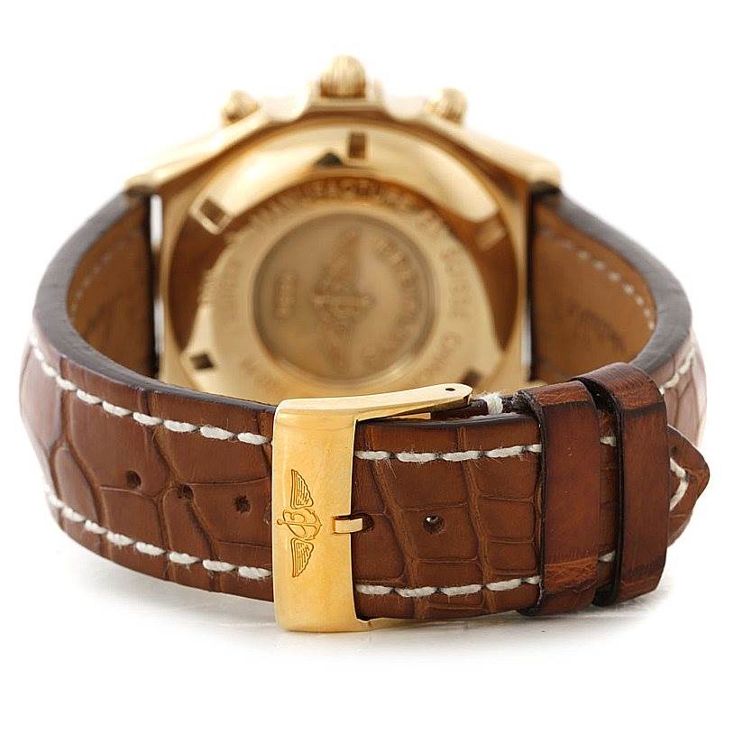 This image shows the back of the Breitling Windrider K13055 Men
s Yellow Gold Blue Dial K13055 Men
s Yellow Gold Blue Dial watch, with its leather strap and gold buckle.