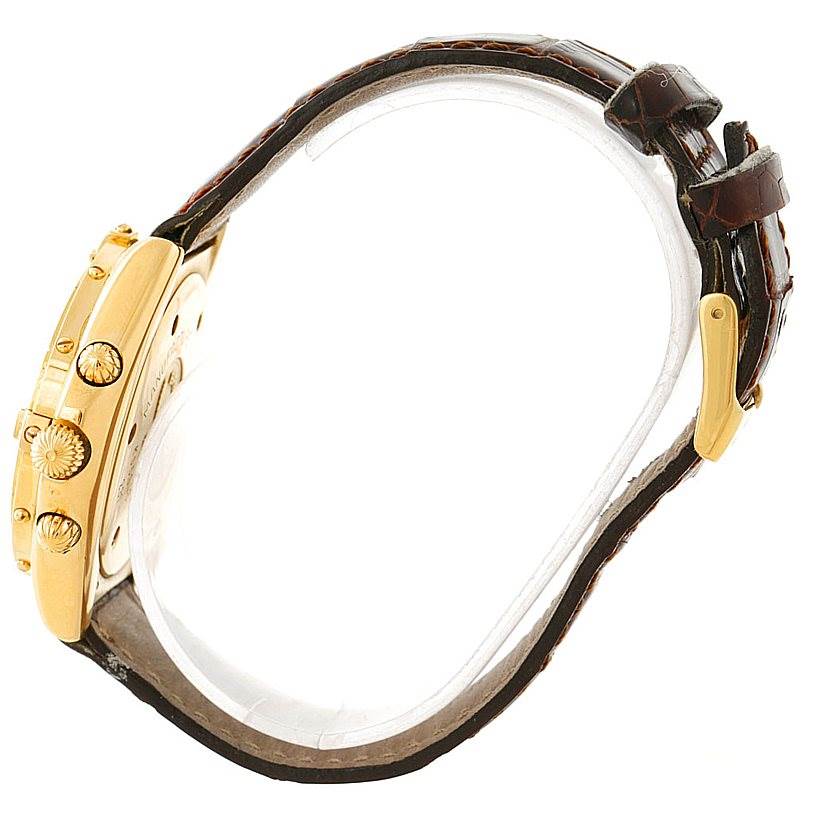 The image shows a side view of the Breitling Windrider K55046 Men's Yellow Gold White Dial K55046 Men's Yellow Gold White Dial watch, featuring the case, crown, and buttons, alongside a leather strap.