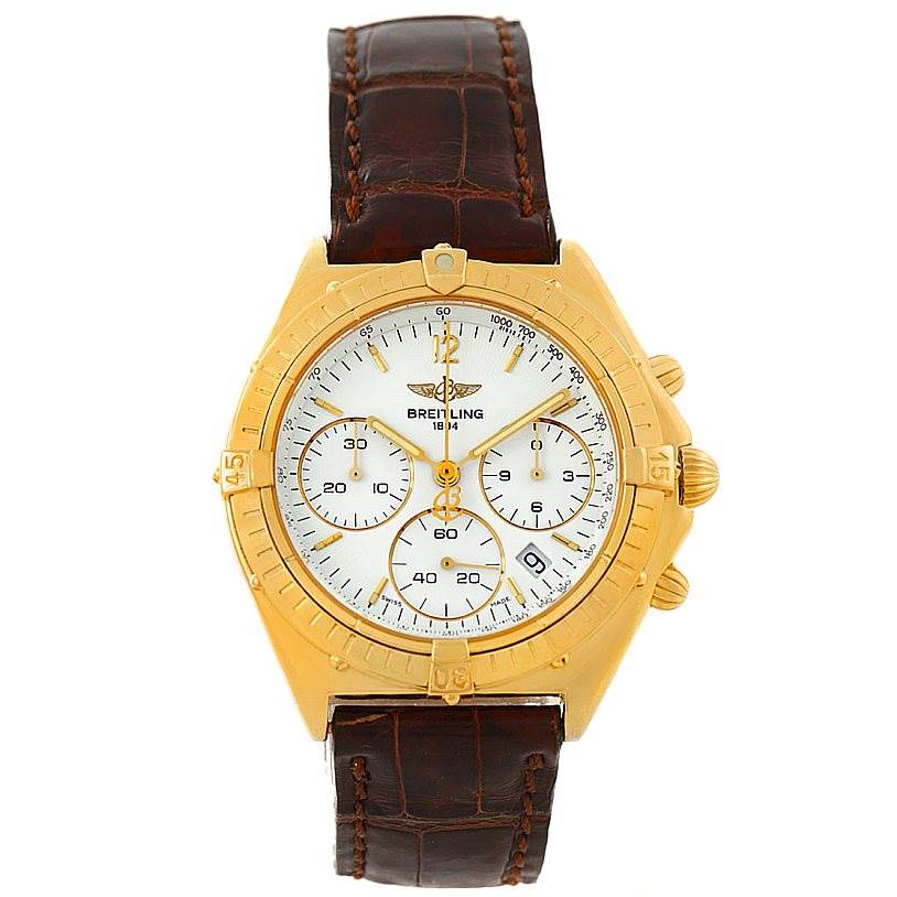 The image shows a front view of the Breitling Windrider K55046 Men's Yellow Gold White Dial K55046 Men's Yellow Gold White Dial watch with a gold case, white dial, and brown leather strap.